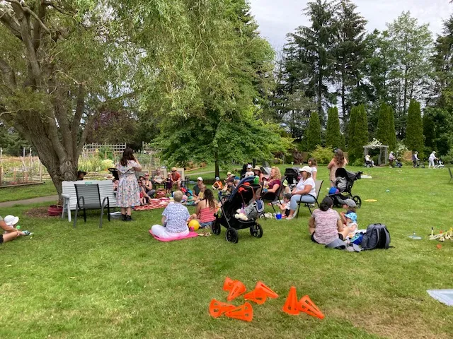 A group of families attending an event at the Gardens
